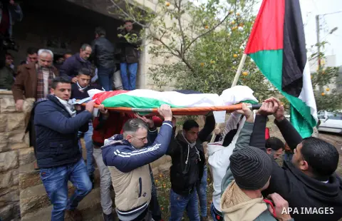 Mourners carry the body of Palestinian Rahiq Birawi, who according to the Israeli police was shot dead after she had advanced towards them with a knife in her hand at a checkpoint last October, during her funeral after I...