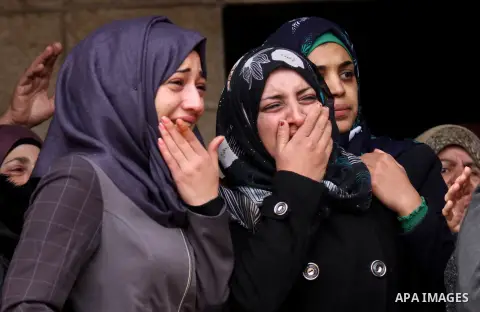 Relatives of Palestinian Rahiq Birawi, who according to the Israeli police was shot dead after she had advanced towards them with a knife in her hand at a checkpoint last October, mourn during her funeral after Israel re...