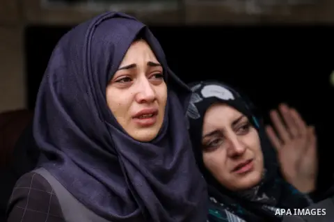 Relatives of Palestinian Rahiq Birawi, who according to the Israeli police was shot dead after she had advanced towards them with a knife in her hand at a checkpoint last October, mourn during her funeral after Israel re...