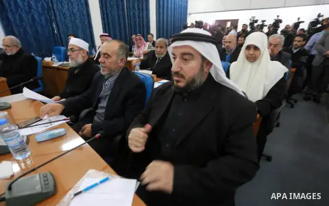 Members of the Palestinian legislative council from Hamas movement attend a meeting at the legislative council in Gaza city, on December 21, 2016. Photo by Mohammed Asad