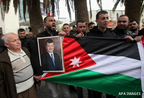 Palestinians take part during a protest to show solidarity with Jordan against terrorist attacks in the West Bank city of Nablus, on December 21, 2016. Jordanian security forces have arrested a man suspected of funding a...