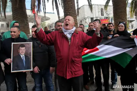 Palestinians take part during a protest to show solidarity with Jordan against terrorist attacks in the West Bank city of Nablus, on December 21, 2016. Jordanian security forces have arrested a man suspected of funding a...