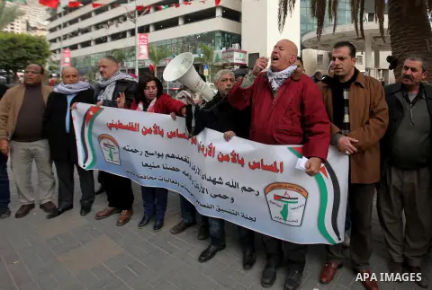Palestinians take part during a protest to show solidarity with Jordan against terrorist attacks in the West Bank city of Nablus, on December 21, 2016. Jordanian security forces have arrested a man suspected of funding a...