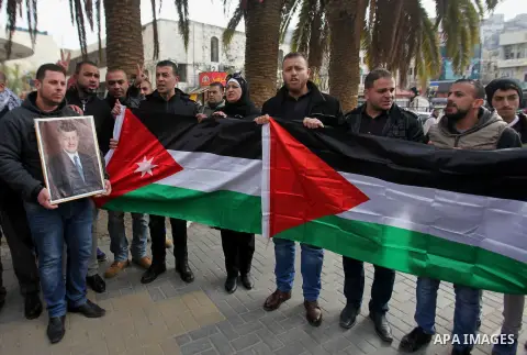 Palestinians take part during a protest to show solidarity with Jordan against terrorist attacks in the West Bank city of Nablus, on December 21, 2016. Jordanian security forces have arrested a man suspected of funding a...