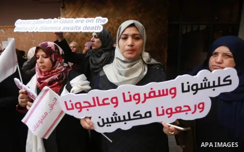Palestinian Cancer patients take part in a protest to demand to travel for treatment, in Gaza city December 22, 2016. Photo by Mohammed Asad