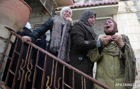 Relatives of Palestinian Jihad Khalil, who according to the Israeli police was shot and killed by an Israeli security guard after Khalil tried to stab him last November, mourn during his funeral after Israel released his...