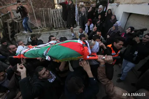 Mourners carry the body of Palestinian Jihad Khalil, who according to the Israeli police was shot and killed by an Israeli security guard after Khalil tried to stab him last November, during his funeral after Israel rele...