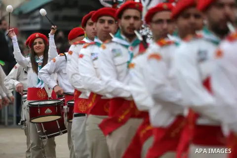 Palestinian Christian scouts perform at the Manger Square outside the Church of the Nativity as people gather for Christmas celebrations in the city of Bethlehem in the Israeli-occupied West Bank, on December 24, 2016. P...
