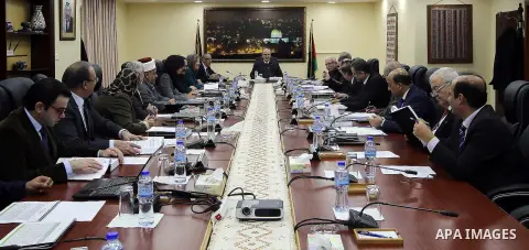 Palestinian Prime Minister, Rami Hamdallah, chairs a meeting of the council Ministers, in the West Bank city of Ramallah, on December 27, 2016. Photo by Prime Minister Office
