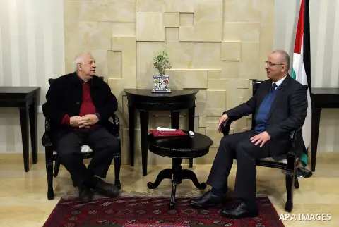 Palestinian Prime Minister, Rami Hamdallah, meets with the Palestinian chief of Election Commissioner, Hanna Nasser, in the West Bank city of Ramallah, on December 28, 2016. Photo by Prime Minister Office