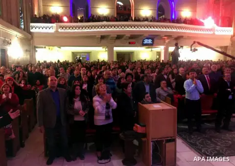 Egyptian Christians attend a religious mass at the Kasr El Dobara Evangelical Church to celebrate New year in Cairo, Egypt on December 31, 2016. Photo by Stringer
