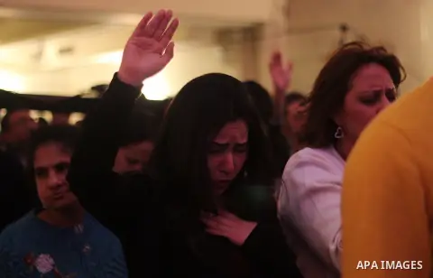 Egyptian Christians attend a religious mass at the Kasr El Dobara Evangelical Church to celebrate New year in Cairo, Egypt on December 31, 2016. Photo by Stringer