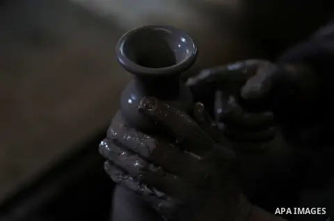 Palestinian Jamal al-Fawakherji, 53, works at a pottery workshop, in the West Bank city of Jenin, on February 4, 2020. The village of Jaba is famous for making pottery because of the presence of special soil for making p...