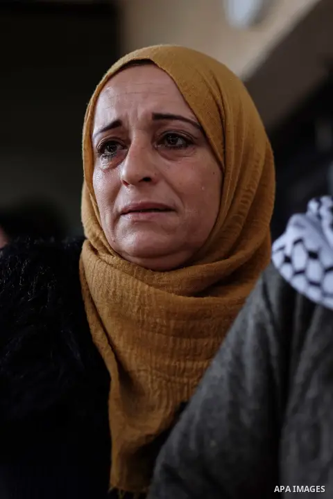 Relatives of Palestinian police officer Tareq Badwan, who was killed in Jenin, mourn during his funeral in the West Bank village of Azoun near Qalqilya, on February 7, 2020. Badwan was shot while standing at the entrance...