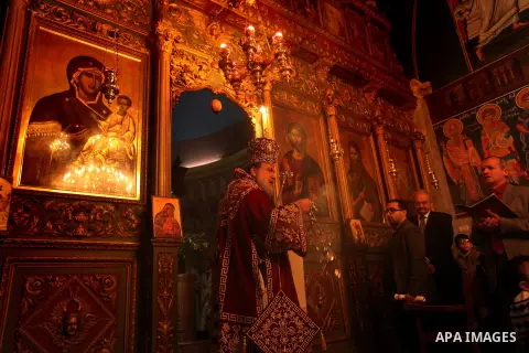 Palestinian Orthodox Christian altar boys attend a Christmas mass at the Saint Porphyrios Greek Orthodox church in Gaza City on January 7, 2017. According to the Gregorian calendar, Orthodox Christmas falls 13 days after...