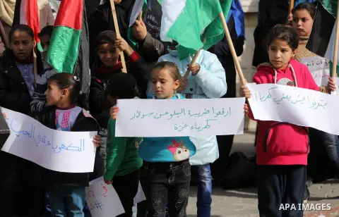 Palestinian children take part in a protest against power cut in Gaza city, on January 10, 2017. The power plant has not run at full capacity in years, with Israel's crippling blockade severely limiting fuel imports into...