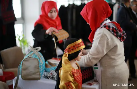 Palestinians take part in a Heritage exhibition for handicrafts products in Gaza city, on January 17, 2017. Photo by Mohammed Asad