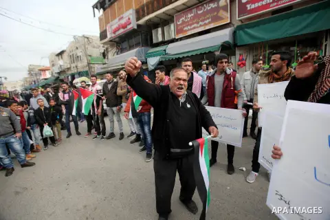Palestinians take part during a protest against US President Donald Trump's pledge to move his country's embassy to Jerusalem and to show solidarity with Palestinian in Bedouin village of Umm al-Hiran, in the West Bank c...