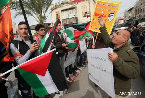 Palestinians take part during a protest against US President Donald Trump's pledge to move his country's embassy to Jerusalem and to show solidarity with Palestinian in Bedouin village of Umm al-Hiran, in the West Bank c...