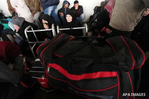 Palestinians wait for travel permits to cross into Egypt through the Rafah border crossing after it was opened by Egyptian authorities for humanitarian cases, in Rafah in the southern Gaza Strip January 28, 2017. Photo b...