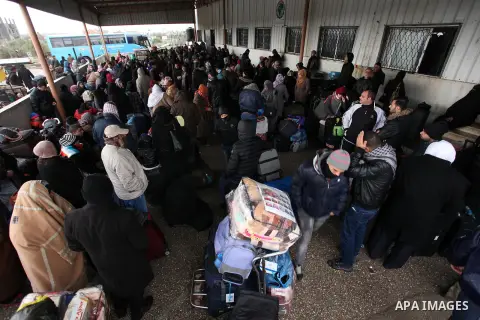 Palestinians wait for travel permits to cross into Egypt through the Rafah border crossing after it was opened by Egyptian authorities for humanitarian cases, in Rafah in the southern Gaza Strip January 28, 2017. Photo b...