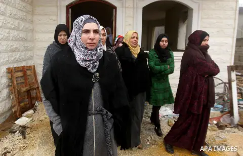 Fatima, the mother of Majd al-Khudur, a Palestinian woman who was killed by Israeli security forces during a car-ramming attack last year, attends the funeral of her daughter in the West Bank village of Bani Naim near He...