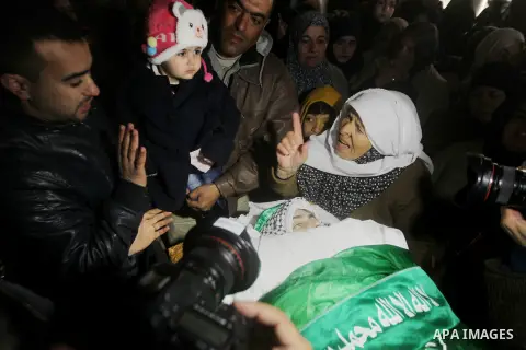 Relatives of Majd al-Khudur, a Palestinian woman who was killed by Israeli security forces during a car-ramming attack last year, mourns during her funeral in the West Bank village of Bani Naim near Hebron on January 28,...