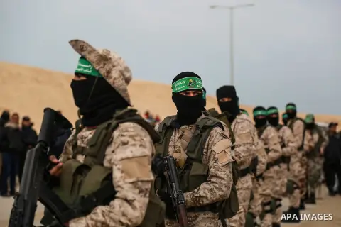 Members of the Ezzedine al-Qassam Brigades, the military wing of the Palestinian Islamist movement Hamas, attend a memorial in Rafah in the southern Gaza Strip on January 31, 2017, for Mohamed Zouari, a 49-year-old Tunis...
