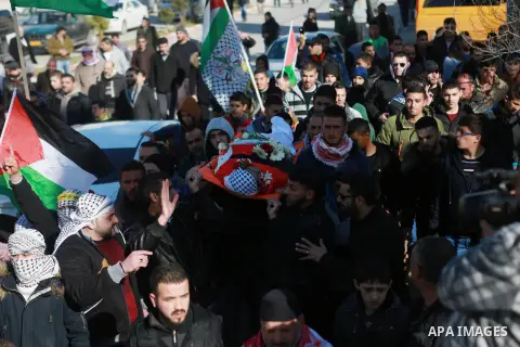 Mourners carry the body of Mohammad Zeidan, 16, a PMourners carry the body of Mohammad Zeidan, 16, a Palestinian youth who was killed by Israeli security forces on Nov. 25 after allegedly attempting to carry out a stabbi...