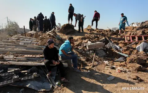 Palestinians inspect the damage to a chicken farm in Gaza City's eastern suburb of Shujaiya on February 7, 2017, following a series of strikes carried out the day before by Israeli forces against the Hamas movement in th...