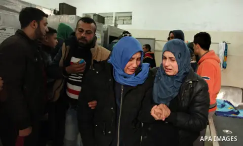 Relatives of one of the two Palestinians, who were killed in a bombing of a tunnel near the Egyptian border, react at a hospital in Rafah in the southern Gaza Strip February 9, 2017. Photo by Ashraf Amra