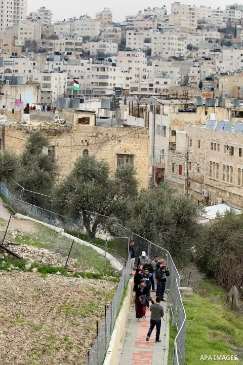 Palestinian schoolchildren take part in a protest calling for reopening of a closed street, in the West Bank city of Hebron February 9, 2017. Photo by Wisam Hashlamoun