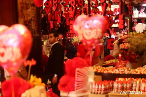 Palestinian vendors display flowers, red teddy bears, red ballons and pillows on Valentine's day in Gaza city on February 14, 2017. Valentine's Day is increasingly popular in the region as people have taken up the custom...