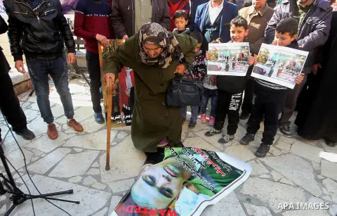 A Palestinian woman reacts during a demonstration following a verdict in the trial of the Israeli soldier Elor Azaria who in March 2016 shot dead wounded alleged Palestinian assailant Abdul Fatah al-Sharif as he lay on t...
