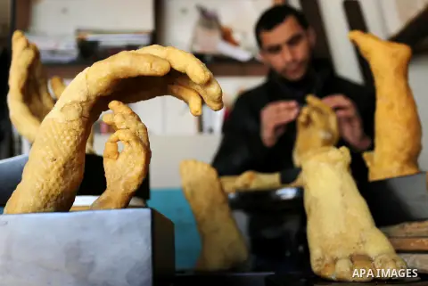 Palestinian artist, Mohammed Abu Hashish, 29, uses beeswax to produce models of human limb, at his workshop, in the al-Maghazi refugee camp, in the centre of the Gaza Strip, on February 27, 2017. Photo by Ashraf Amra