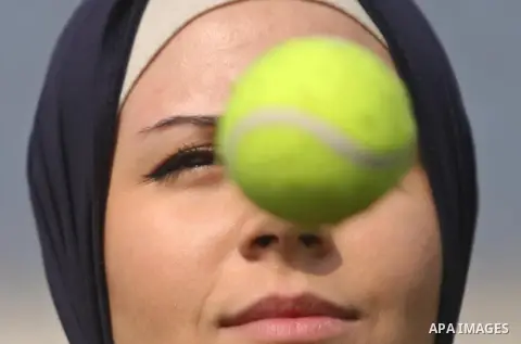 A Palestinian girl takes part in Baseball training, in Gaza city, on February 20, 2017. Baseball is a bat-and-ball game played between two teams of nine players each, who take turns batting and fielding. Baseball is thou...