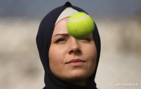 A Palestinian girl takes part in Baseball training, in Gaza city, on February 20, 2017. Baseball is a bat-and-ball game played between two teams of nine players each, who take turns batting and fielding. Baseball is thou...
