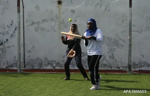 Palestinian girls take part in Baseball training, in Gaza city, on February 20, 2017. Baseball is a bat-and-ball game played between two teams of nine players each, who take turns batting and fielding. Baseball is though...