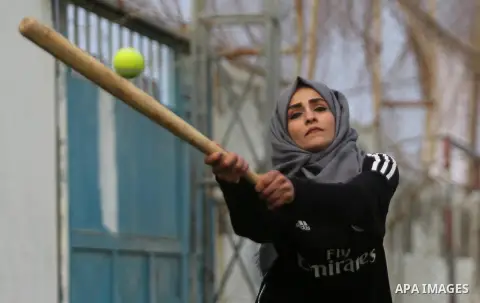 A Palestinian girl takes part in Baseball training, in Gaza city, on February 20, 2017. Baseball is a bat-and-ball game played between two teams of nine players each, who take turns batting and fielding. Baseball is thou...