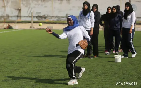 Palestinian girls take part in Baseball training, in Gaza city, on February 20, 2017. Baseball is a bat-and-ball game played between two teams of nine players each, who take turns batting and fielding. Baseball is though...