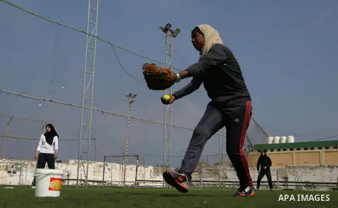Palestinian girls take part in Baseball training, in Gaza city, on February 20, 2017. Baseball is a bat-and-ball game played between two teams of nine players each, who take turns batting and fielding. Baseball is though...