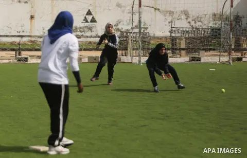 Palestinian girls take part in Baseball training, in Gaza city, on February 20, 2017. Baseball is a bat-and-ball game played between two teams of nine players each, who take turns batting and fielding. Baseball is though...