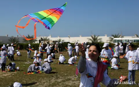 Palestinian schoolgirls fly kites to show solidarity with the Japanese people during an event organised by the United Nations Relief and Works Agency (UNRWA) to mark the the sixth anniversary of the Tohoku earthquake and...