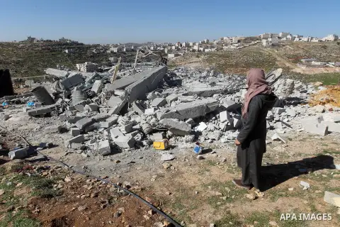 A Palestinian woman looks for her belongings amongst the rubble of her house after it was demolished by the Israeli army as it did not have an Israeli-issued construction permit, in the West Bank city of Hebron March 6,...