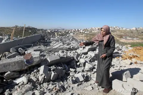 A Palestinian woman looks for her belongings amongst the rubble of her house after it was demolished by the Israeli army as it did not have an Israeli-issued construction permit, in the West Bank city of Hebron March 6,...