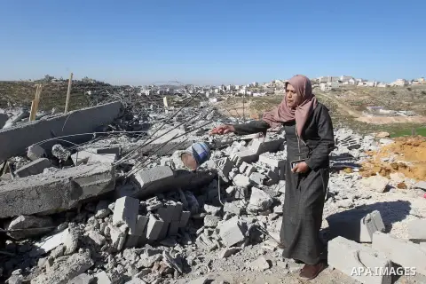 A Palestinian woman looks for her belongings amongst the rubble of her house after it was demolished by the Israeli army as it did not have an Israeli-issued construction permit, in the West Bank city of Hebron March 6,...