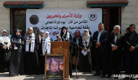Palestinian women take part in a protest to show soldirity with Palestinian female prisoners in Israeli jails on the occasion of International Women's Day in Gaza City on March 7, 2017. Photo by Mohammed Asad