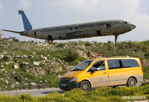 A retired Boeing airplane once belonging to an Israeli airline is seen in the west bank city of Nablus, on March 7, 2017. Photo by Wisam Hashlamoun