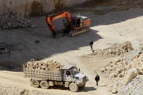 Palestinian labourers work at a quarry in the West Bank village of Taffouh near Hebron, 08 March 2017. According to the Palestinian Union of Stone and Marble, the stone and marble sector is considered to be one of the mo...