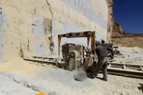 Palestinian labourers work at a quarry in the West Bank village of Taffouh near Hebron, 08 March 2017. According to the Palestinian Union of Stone and Marble, the stone and marble sector is considered to be one of the mo...